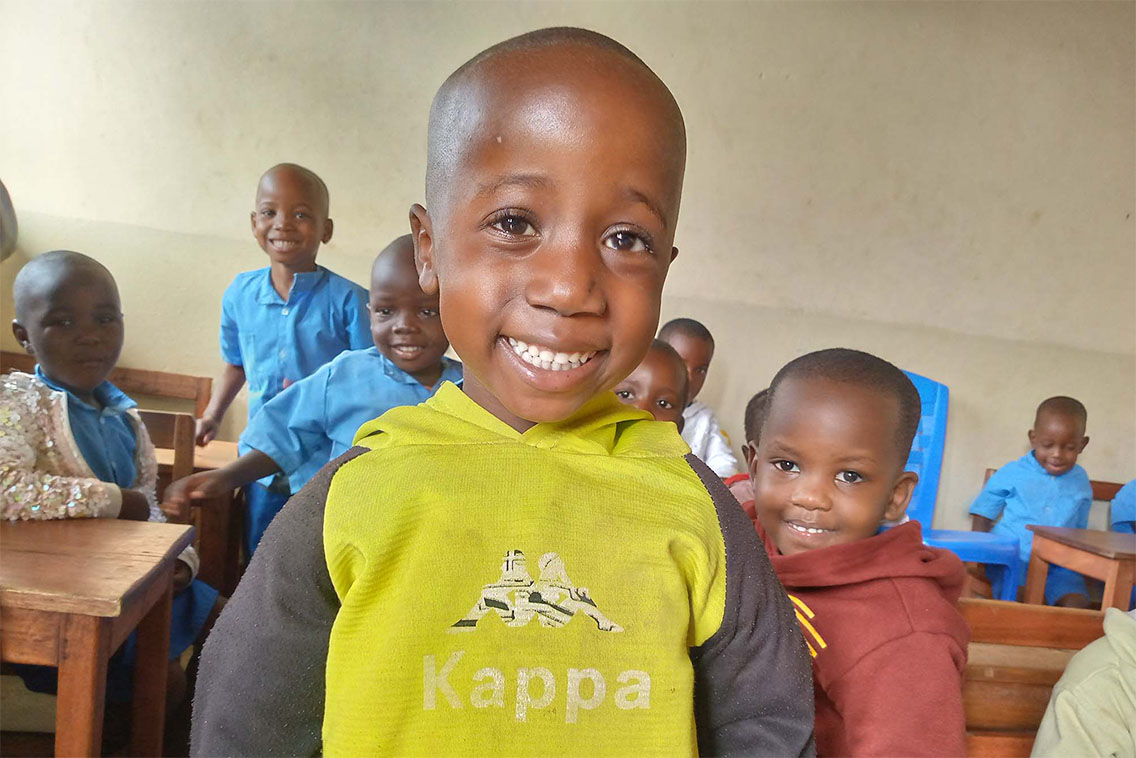 Young girl smiling at the camera.